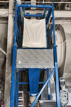 White bulk bag unloading powder in AFC bulk bag unloader